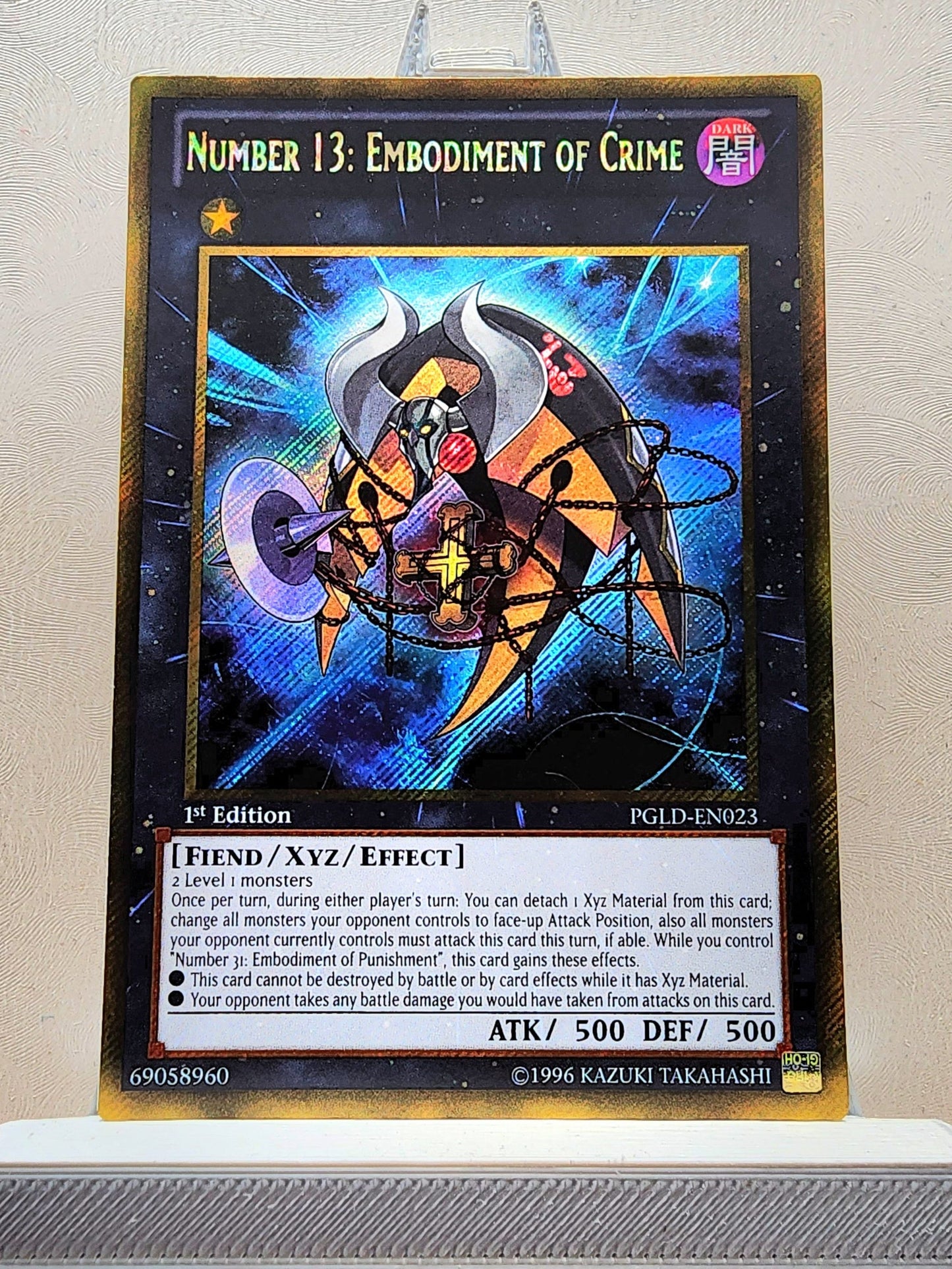 Yugioh! 1x Number 13: Embodiment of Crime (PGLD - Gold Secret Rare) 1st Edition