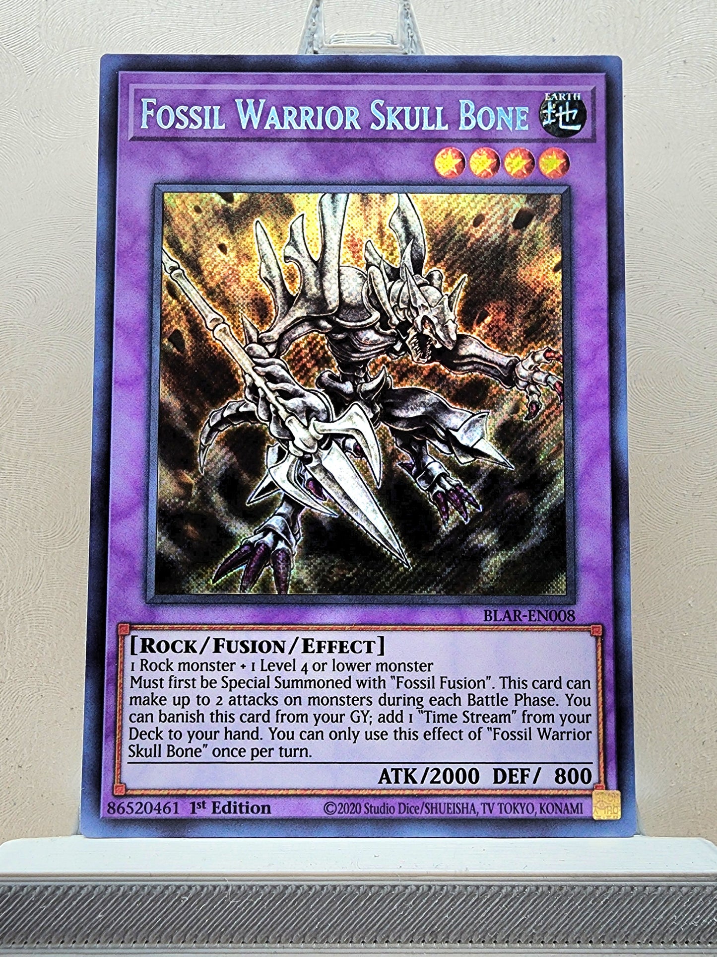 Yugioh! 1x Fossil Warrior Skull Bone (BLAR - Secret Rare) 1st Edition