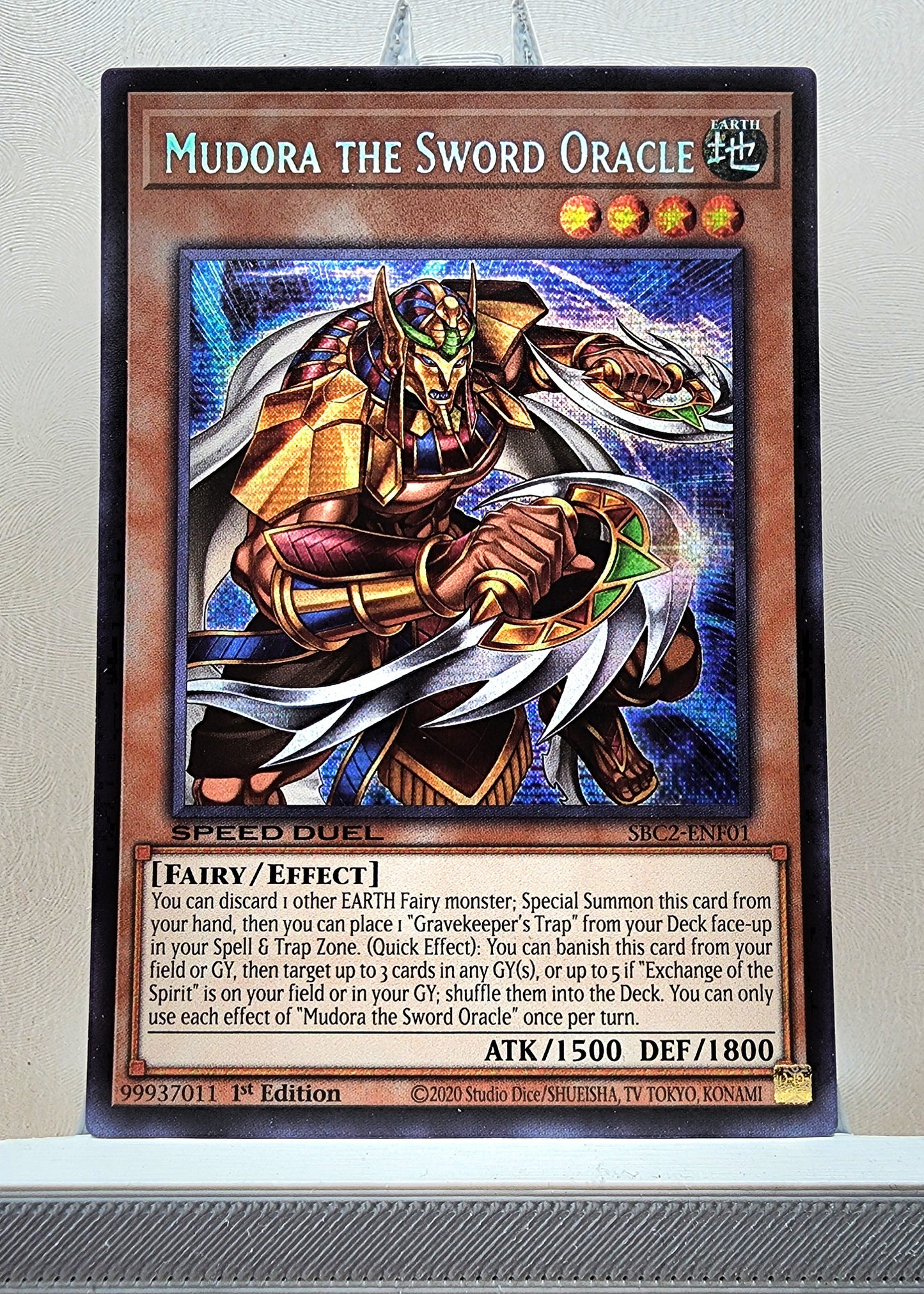 Yugioh! 1x Mudora the Sword Oracle (SBC2 - Prismatic Secret Rare) 1st Edition